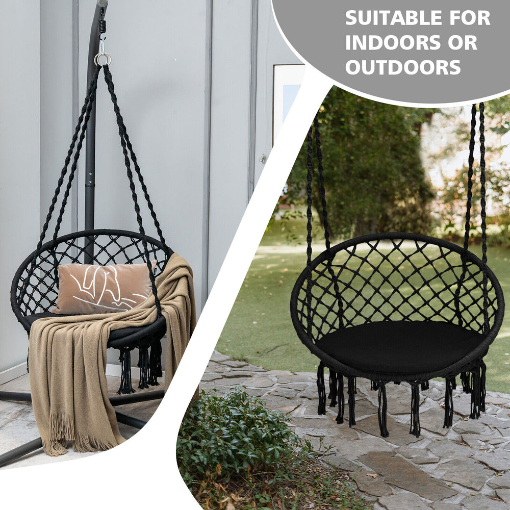 Cushioned black hammock swing chair with tassels, designed for indoor or outdoor relaxation, supports up to 330 lbs.