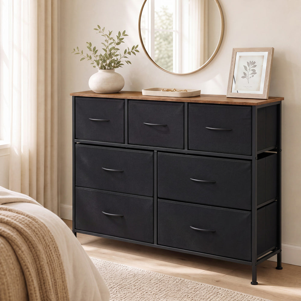 Wide black dresser featuring 7 removable fabric drawers, ideal for bedroom storage and easy maintenance.