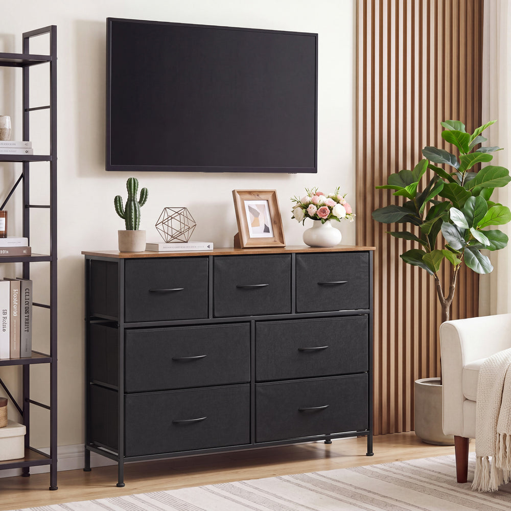 7-drawer wide dresser in black with removable fabric drawers, perfect for bedroom storage and organization.
