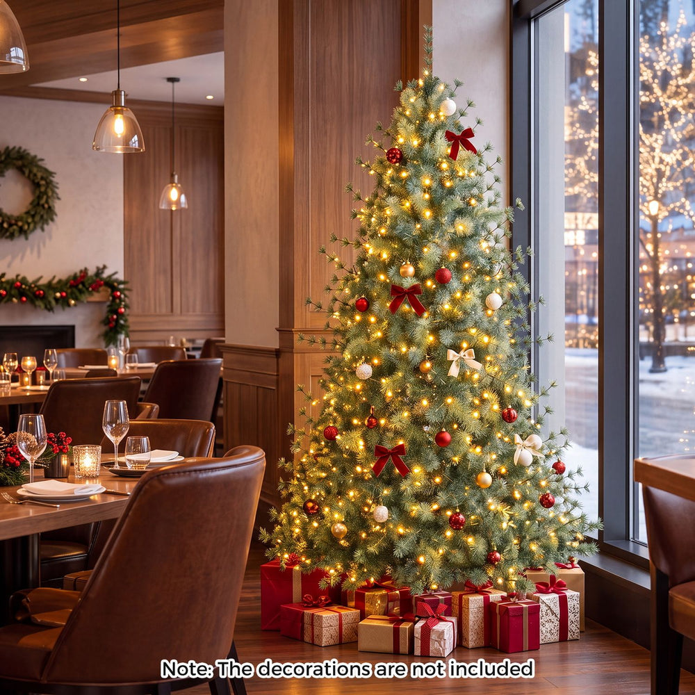 7 FT pre-lit artificial Christmas tree with 400 warm and cool white LED lights displayed with ornaments and gifts.