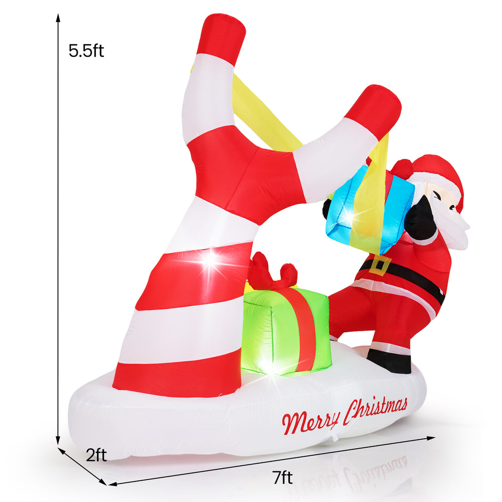 Santa with slingshot and gift boxes, 7 feet tall, LED lights for outdoor Christmas decoration.