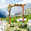 Garden wooden high arbor arch with floral decor, perfect for outdoor weddings and supporting climbing plants.