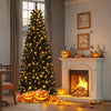 Pre-lit 7ft black artificial Christmas Halloween tree with warm white lights, surrounded by carved pumpkins by the.