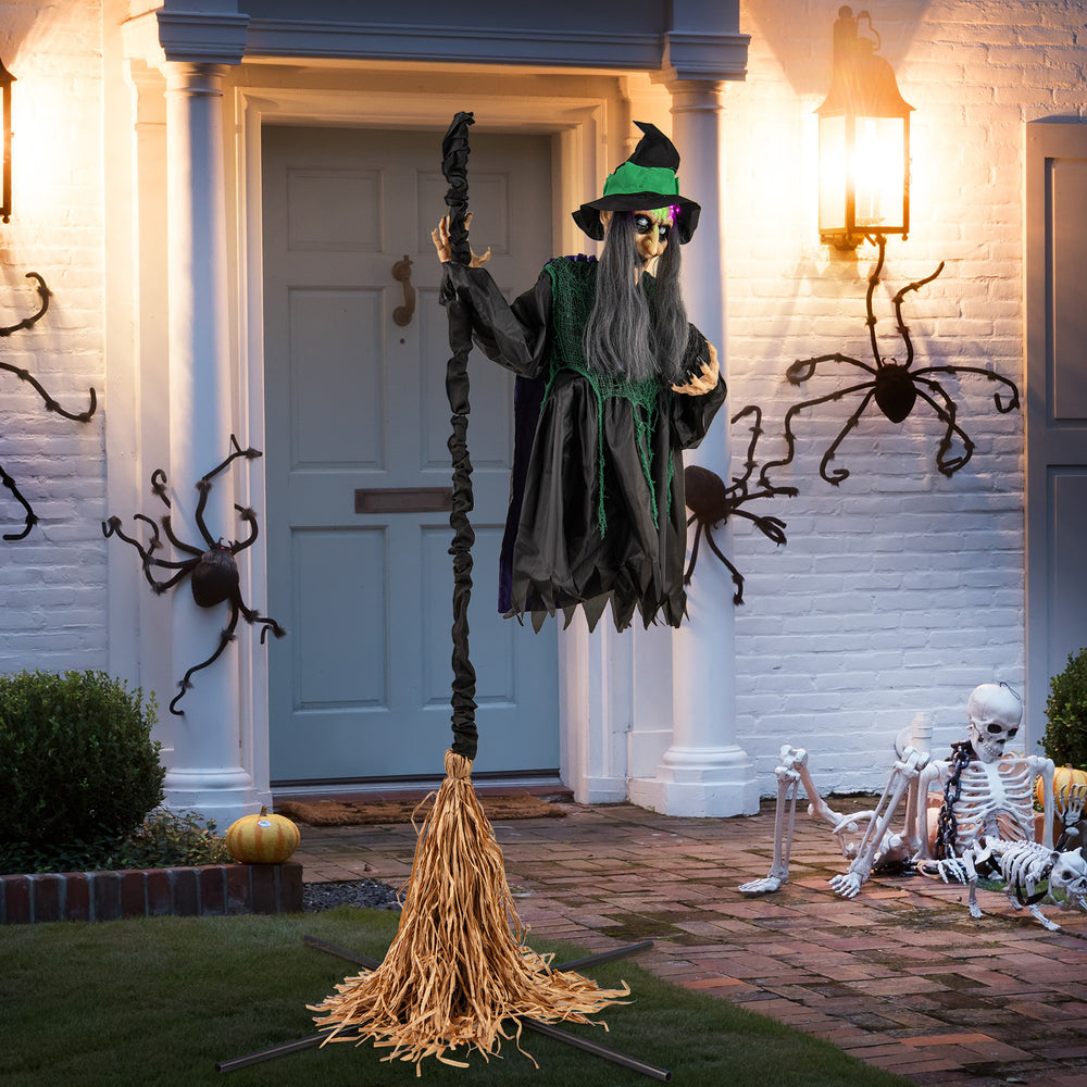 7 feet witch animatronic on broom with a realistic costume and LED lights, ideal for creating a haunted outdoor.