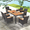 View of the 7-piece outdoor dining set showcasing six rattan chairs and a slatted acacia wood table, perfect for.