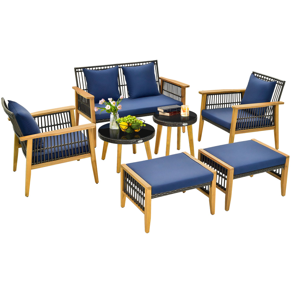 7-piece outdoor conversation set featuring acacia wood frame, navy cushions, and tempered glass tabletop for backyard.