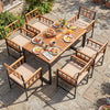 7-piece outdoor dining set featuring an acacia wood table and black metal chairs with cushions, perfect for patio gatherings.