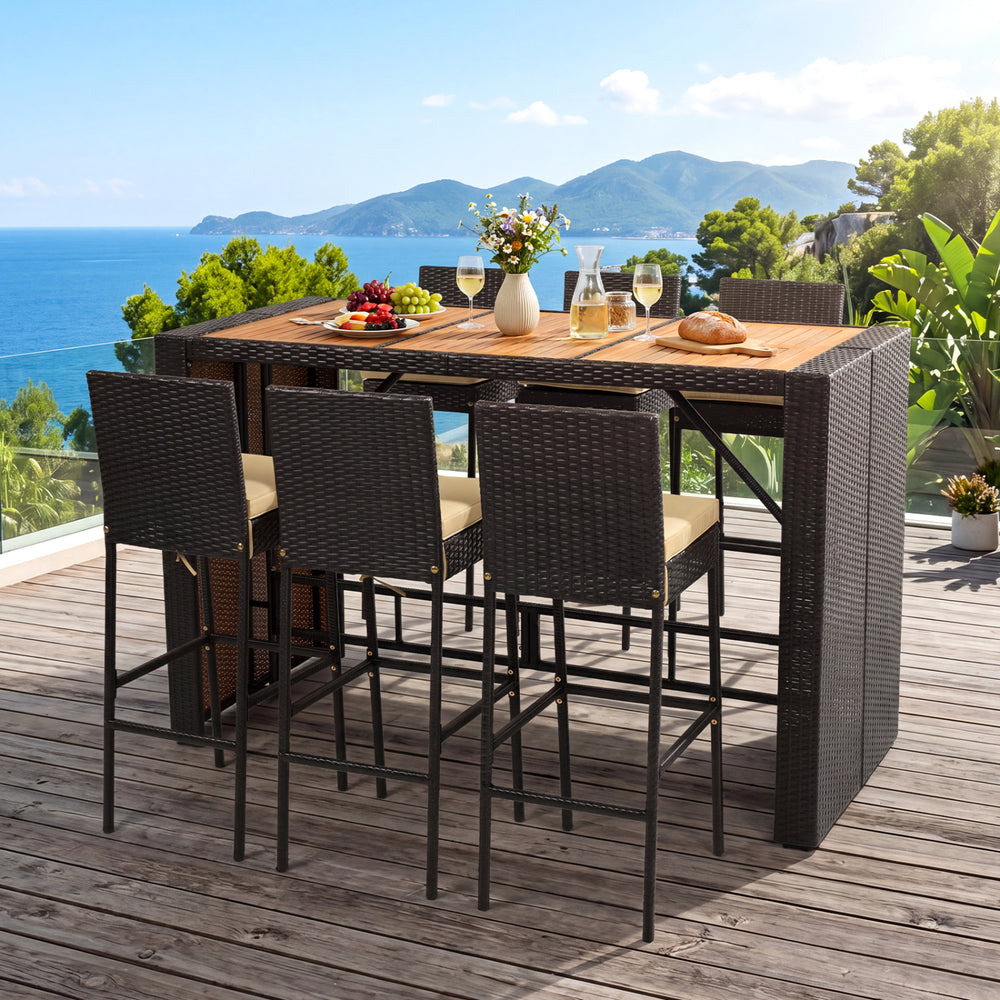 Outdoor 7-piece PE wicker bar set featuring a brown acacia wood table and 6 cushioned stools, perfect for gatherings.