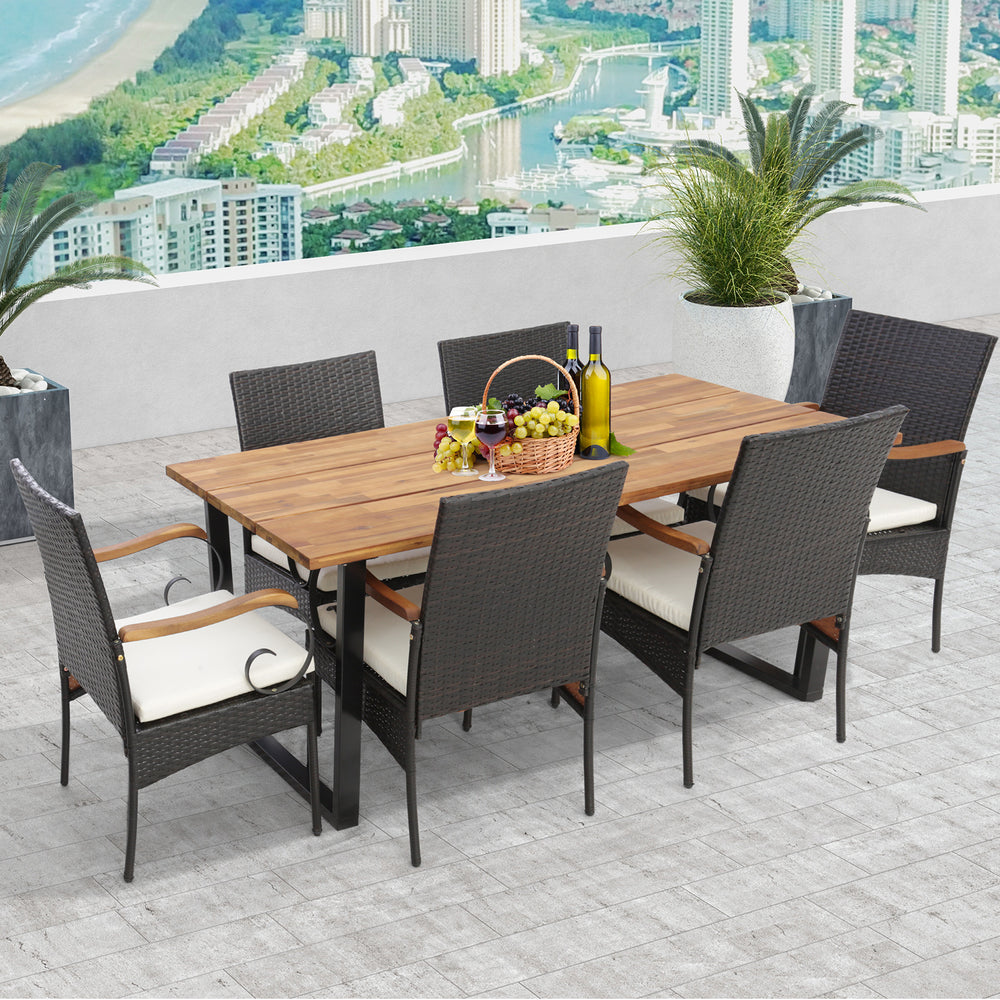 7-piece patio rattan dining set featuring an acacia wood tabletop and ergonomic chairs, perfect for backyard gatherings.