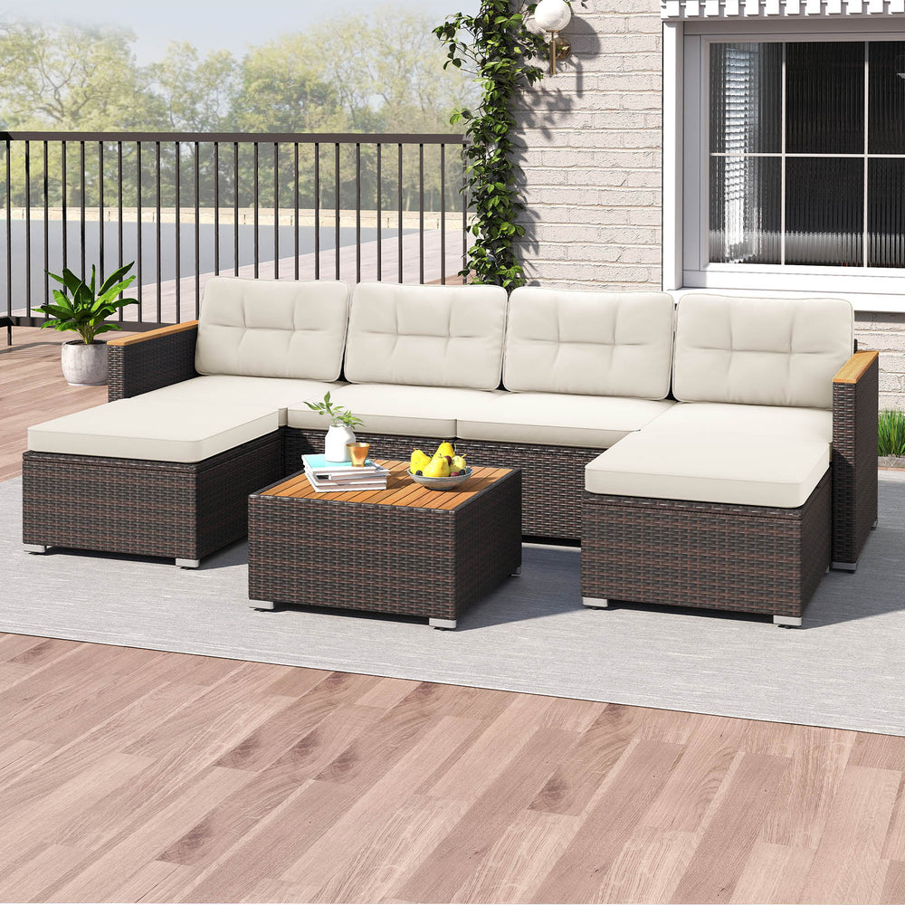 U-shaped 7-piece wicker conversation set with acacia wood armrests and cream cushions, perfect for backyard relaxation.