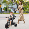 7-in-1 baby stroller tricycle in gray with adjustable canopy and foldable footrests, perfect for ages 9-60 months.