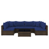 Sectional patio sofa set with navy cushions, PE rattan, and coffee table, perfect for outdoor relaxation.