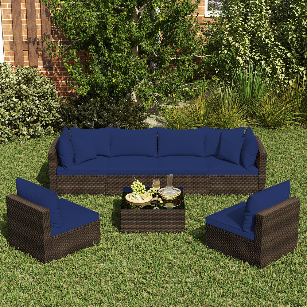 Sectional patio rattan furniture set in navy with cushions, including coffee table, ideal for outdoor relaxation.
