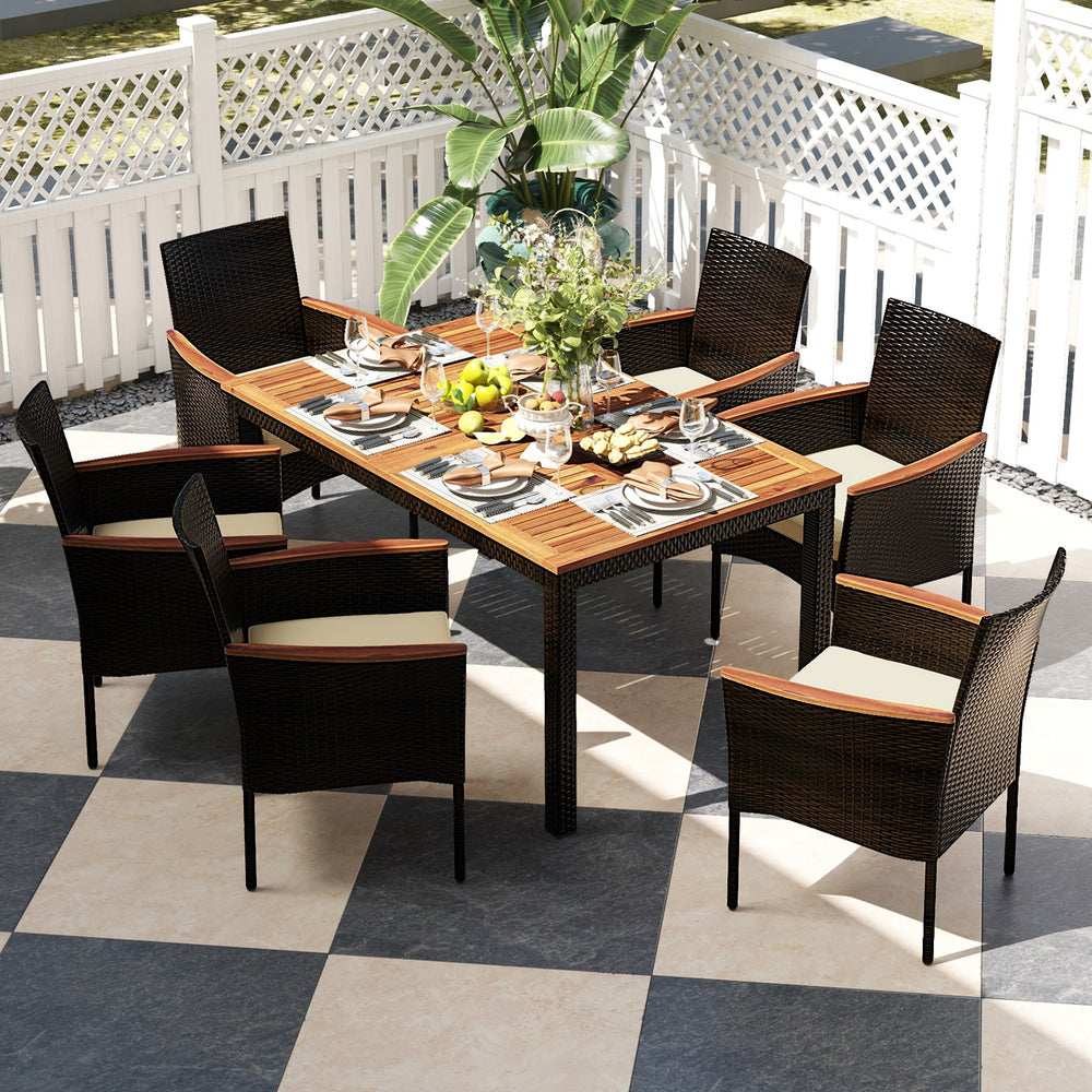7-piece rattan patio dining set with stackable chairs and acacia wood tabletop, perfect for outdoor dining and.