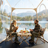 Clear bubble tent with a sealed floor, perfect for camping and outdoor relaxation by the lake.