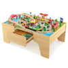 Train and building block table with reversible top, 84-piece train set, and large storage drawer for creative play.