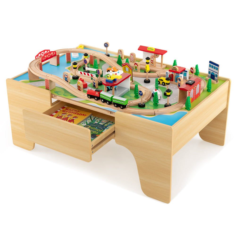 Train and building block table with reversible top, 84-piece train set, and large storage drawer for creative play.
