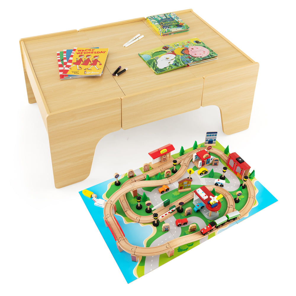Train and building block table with reversible top, 84-piece train set, and spacious storage drawer for creative play.