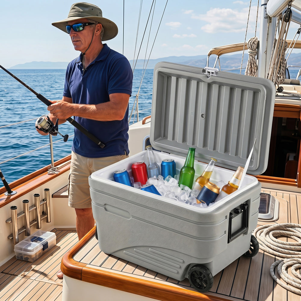Portable 84 Quart wheeled ice cooler in gray with high-performance insulation, ideal for keeping drinks cold on a boat.