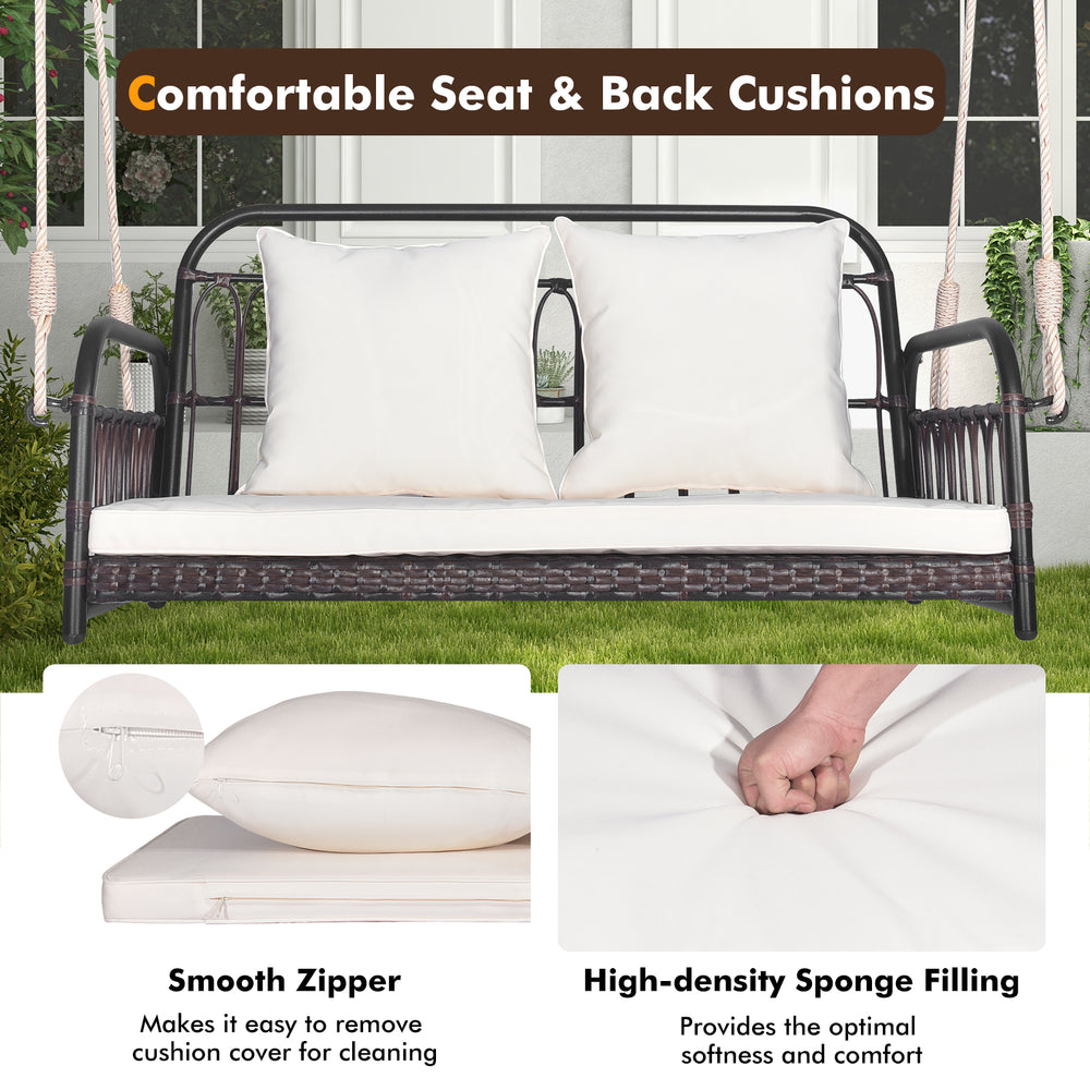 Wicker hanging porch swing with white cushions, featuring removable covers and 880 lbs capacity for outdoor relaxation.