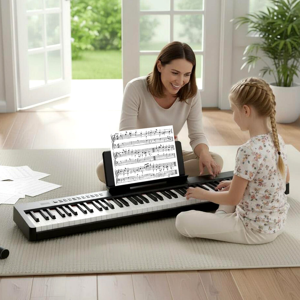 A mother and daughter play together on an 88 keys velocity-sensitive piano keyboard with a black wood texture.