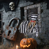 Hanging 18-inch animated skull prisoner decoration with LED eyes, chains, and creepy sound effects for Halloween.