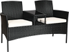 Wicker patio conversation set with removable cushions and tempered glass table, perfect for garden or balcony use.