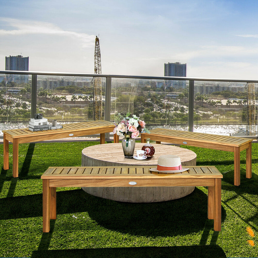 Outdoor acacia wood dining bench with a hollow slat design, providing seating for three, ideal for patios and gardens.
