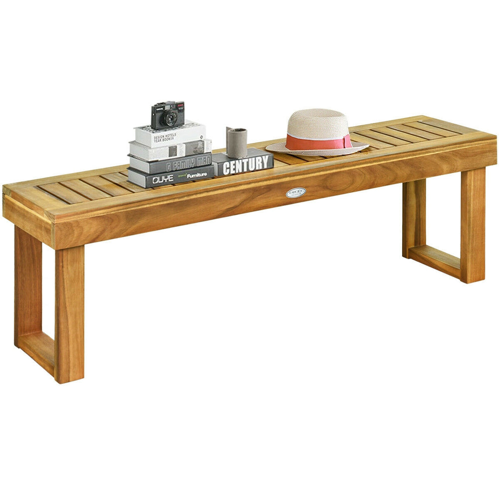 Acacia wood dining bench with slatted seat, natural teak color, sturdy design for outdoor and indoor use.