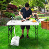 Folding cleaning sink table with faucet and sprayer, perfect for outdoor fish cleaning and gardening tasks.