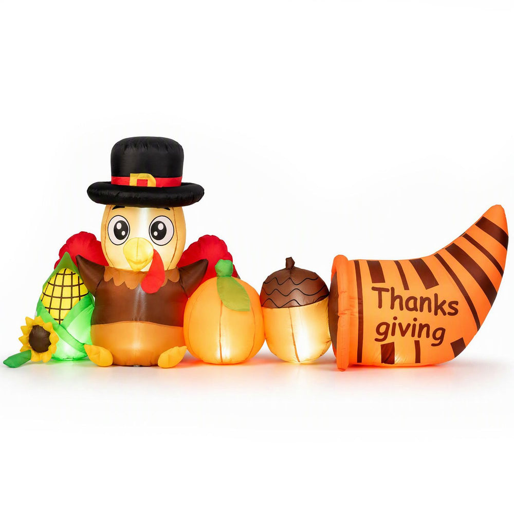 Thanksgiving inflatable turkey featuring a festive hat, lighted pumpkins, and a cornucopia for cheerful outdoor decor.