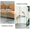 Tempered glass end table shown vertically and horizontally, featuring a minimalist design and non-slip pads for floor.