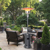 Gray propane outdoor heater with table and wheels, 87" tall, providing warmth for patio gatherings and easy transport.