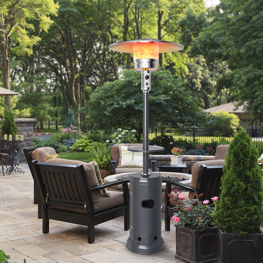 Gray propane outdoor heater with table and wheels, 87" tall, providing warmth for patio gatherings and easy transport.