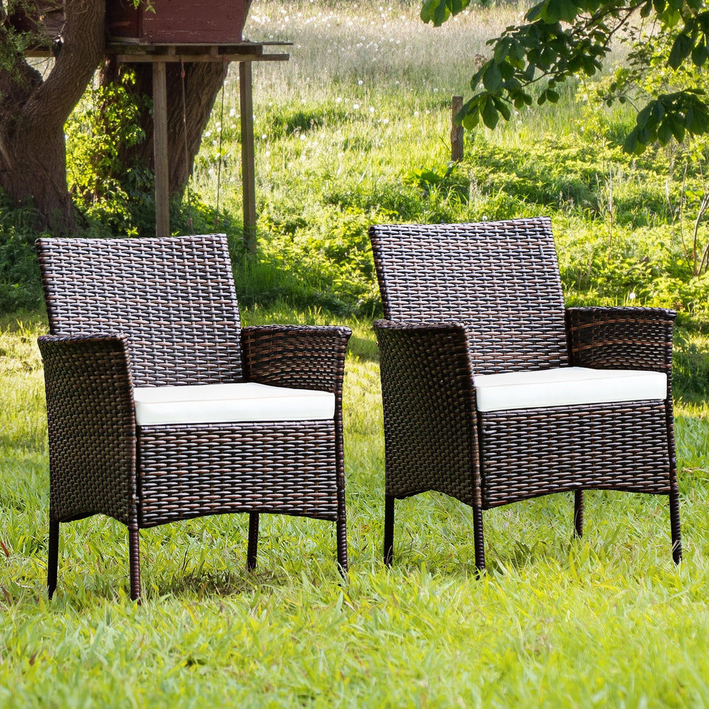 Two outdoor PE rattan armchairs with removable cushions, featuring a sturdy frame and ergonomic design for patio.