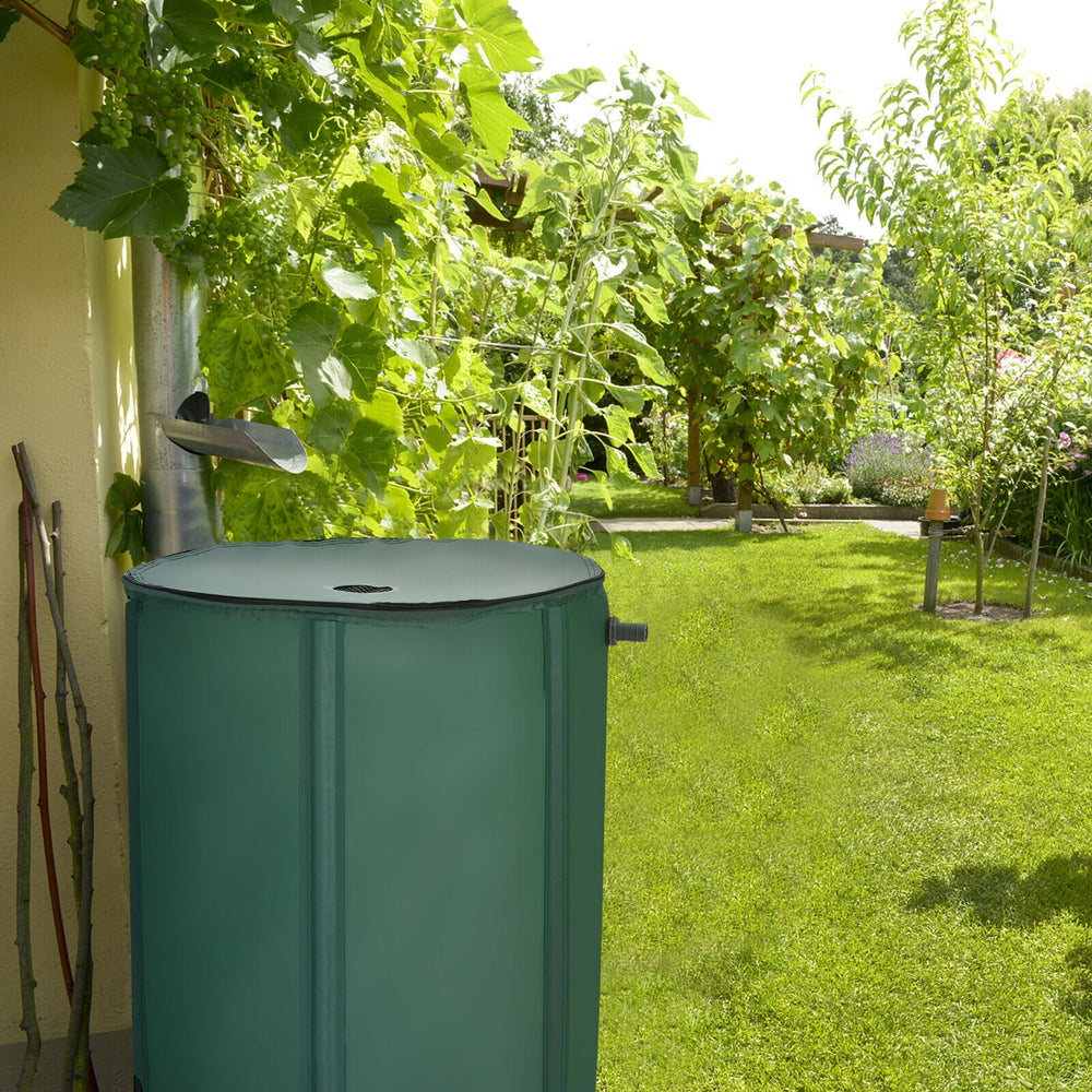 Portable 53-gallon collapsible rain barrel in a garden, designed for collecting rainwater while blocking debris.