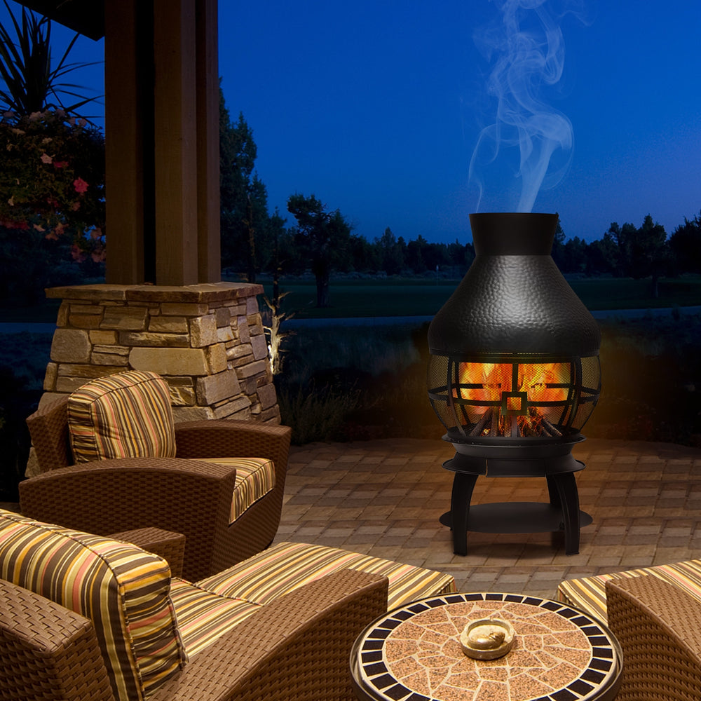 Patio wood burning chimney fireplace in cast iron, featuring a round roof and mesh screening for outdoor warmth.