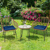 Navy cushioned rattan armchair close-up, showcasing its durable weave and stylish design for comfortable outdoor.