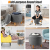 Round gray fabric storage ottoman with removable lid and wooden tray, ideal for seating and storage in any room.