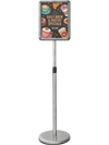 Adjustable 8.5 x 11 inch sign holder stand with a silver aluminum frame, perfect for displaying menus and ads in high-traffic areas.