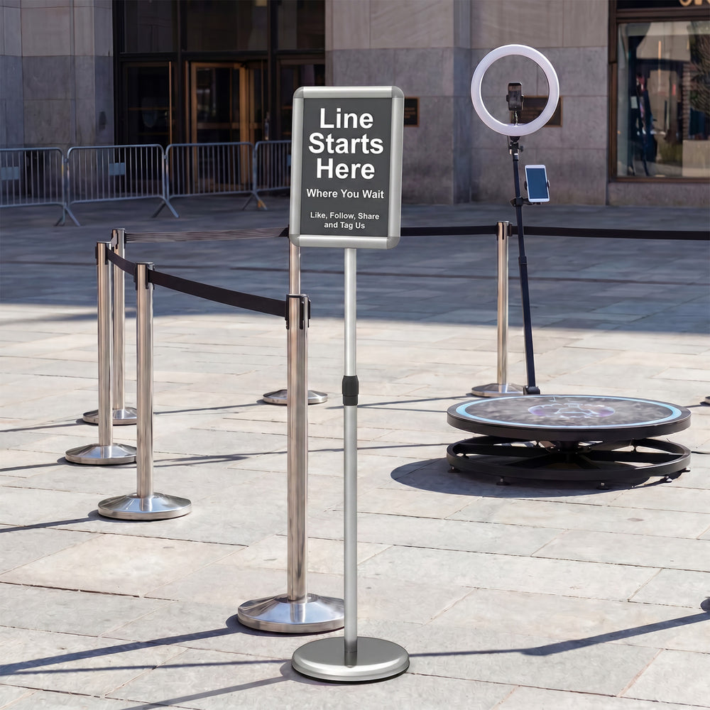 Sign holder stand with 360° rotation, adjustable height, and heavy-duty base for displaying signs and notices.