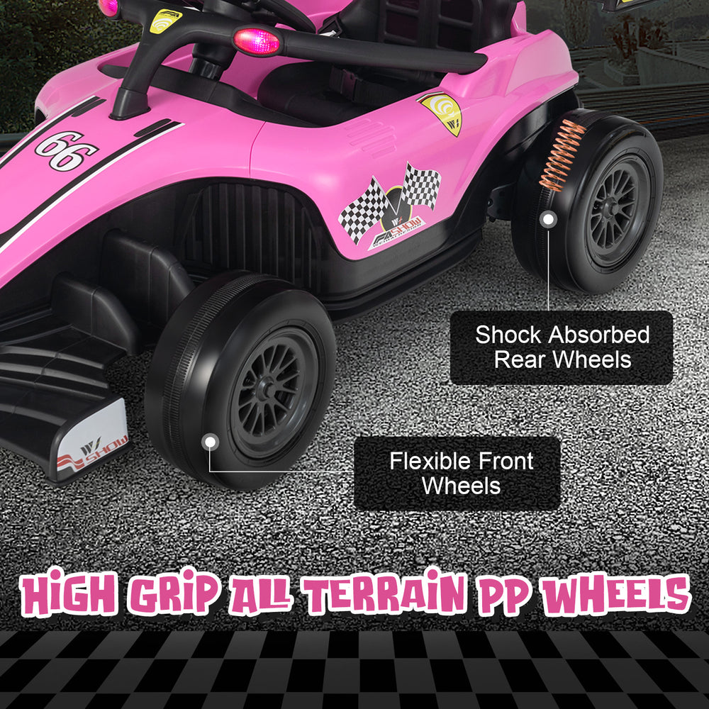 Close-up of the pink kids ride-on Formula racing car showcasing high grip all-terrain PP wheels for versatile driving.