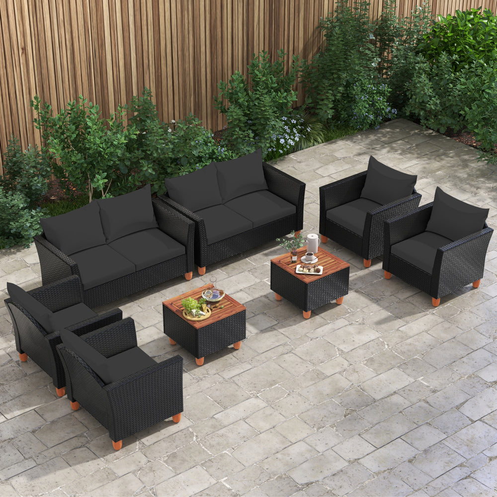Lounge area featuring an 8-piece outdoor seating arrangement with black cushions and a multifunctional storage coffee table.