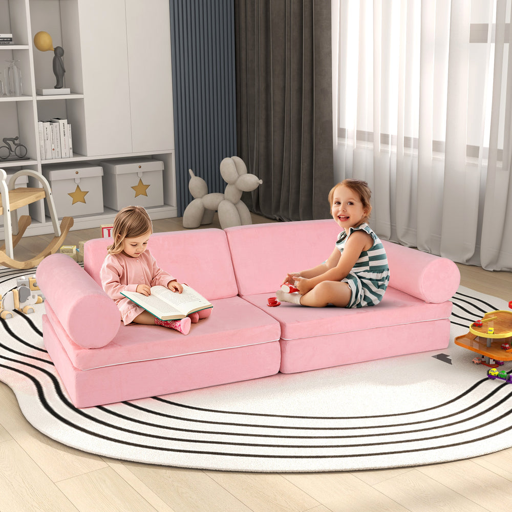 Modular 8-piece kids play couch in pink with suede cover, perfect for imaginative play and comfortable lounging.