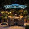 Turquoise 8 x 8 ft solar LED offset cantilever patio umbrella with 360° rotation, providing shade for outdoor dining.
