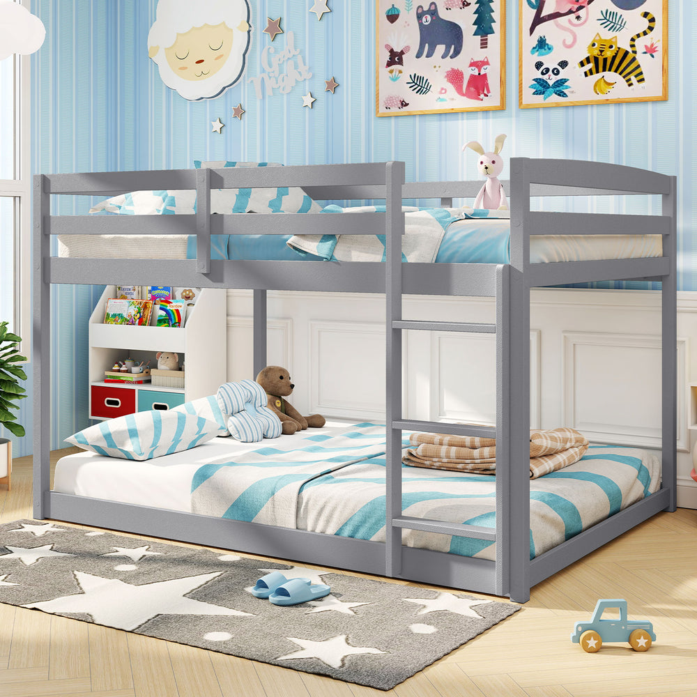 Gray full over full low-to-ground bunk bed with guardrails and integrated ladder, ideal for kids' rooms.