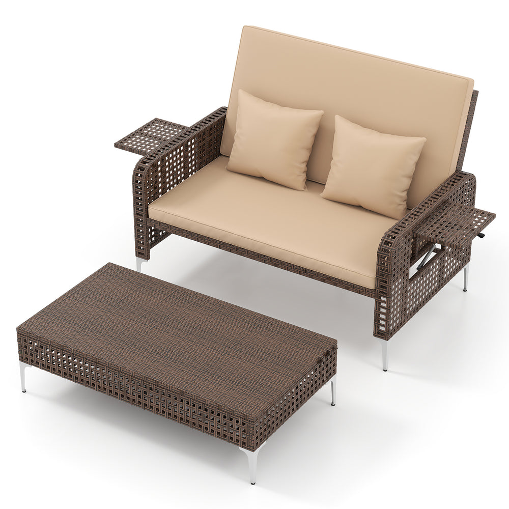 Brown rattan loveseat with soft cushions and adjustable backrest, paired with a matching ottoman for outdoor relaxation.