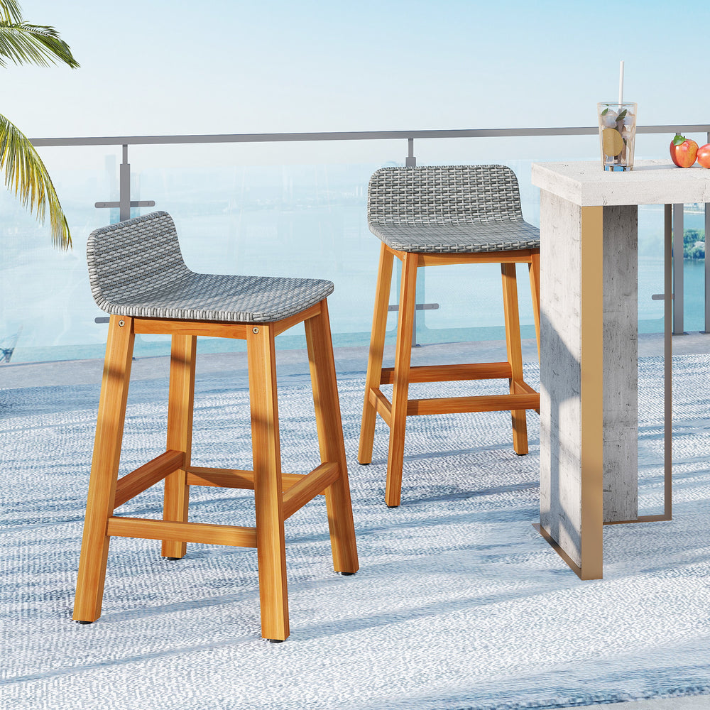 Set of 2 gray bar stools with acacia wood legs and PE rattan seats, perfect for outdoor porch or balcony use.