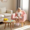 Kids armchair in pink with comfy backrest and armrests, covered in soft teddy fleece, perfect for home or kindergarten.
