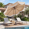 Outdoor tassel umbrella with push button tilt in white, set beside lounge chairs on a patio by the pool.